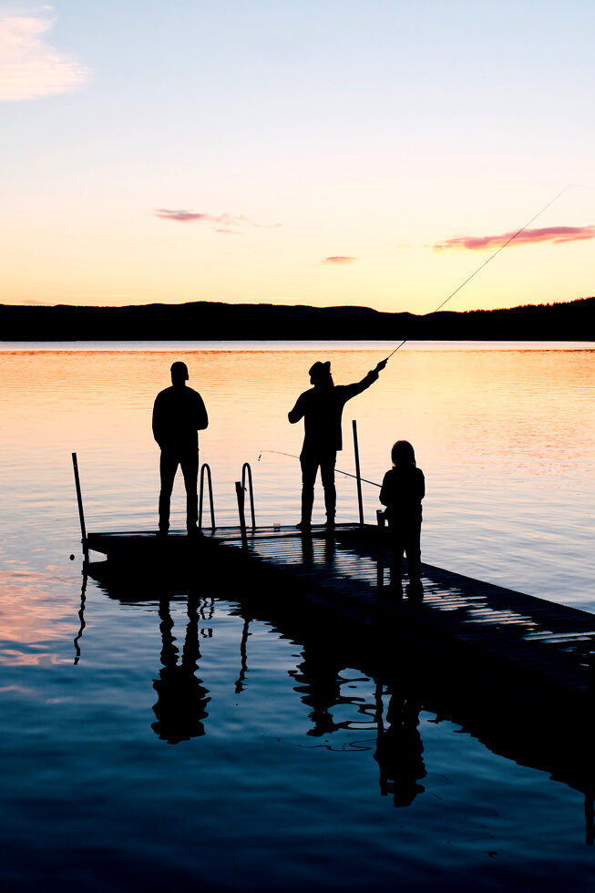 Three People on a Wooden Fishing Docks
